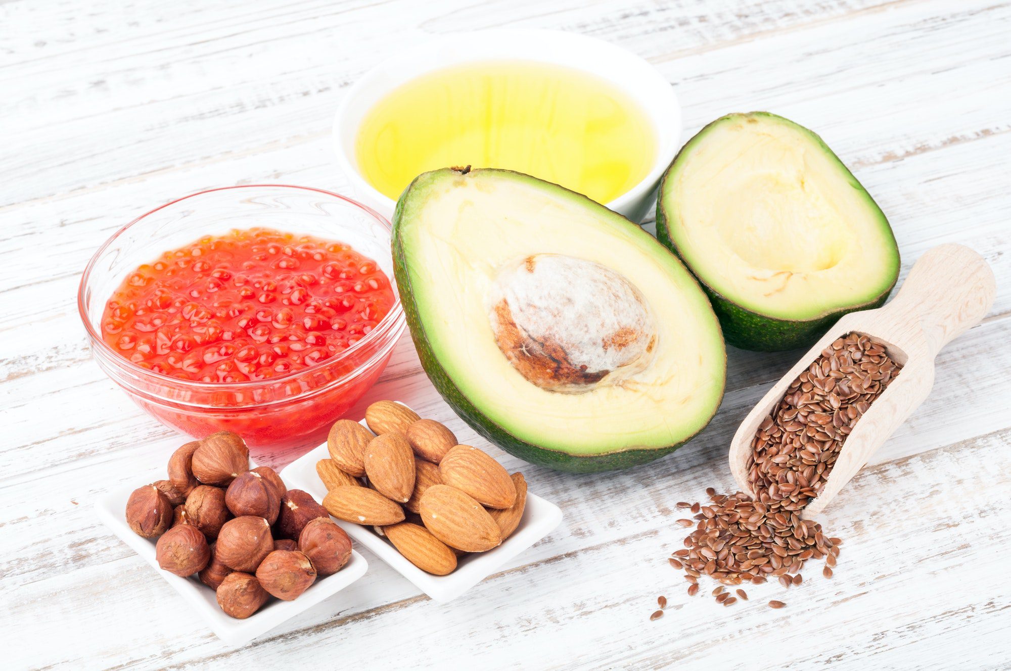 Foods with healthy fats. Sources of omega 3 - avocado, olive oil, red caviar, nuts and flax seed